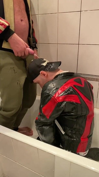 Big Man in Leather Jacket Pissing on Leather Moto Biker