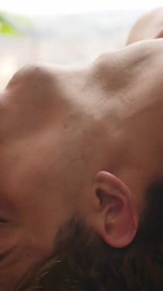 Yuri Is Lying on a Massage Table Against a Beautiful City Backdrop