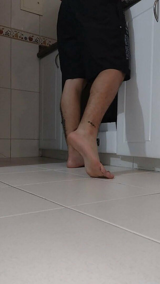 Latino Shows His Feet While Cooking