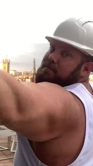 Builder Iron Bending Muscle Flexing and Measuring