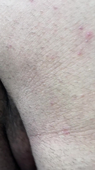 A Macabre Giant Demon Showers in Front of a Tiny Human.