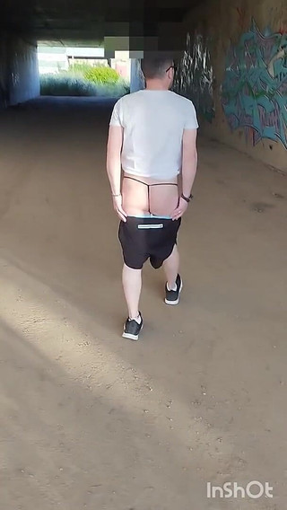 In Showing Her Ass in a Thong