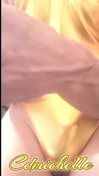 Cdmichelle Wearing Gold Bodysuit