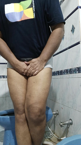 Young Boy in Short Shorts Peeing