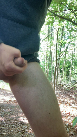 Young boy masturbates and cums in the forest