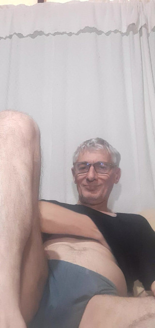 A Beautiful Man in a T-shirt and Underwear Waits to Undress to Start Having Sex.